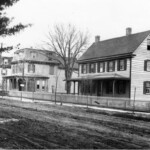 Three houses on Main Street. Left two mansard houses are #164 and #166 East Main Street.